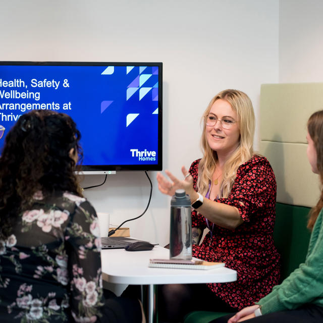 Blond female colleague presenting health & wellbeing induction