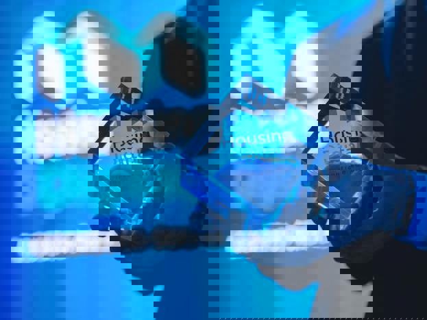 housing digital innovation award trophy in front of projection screen